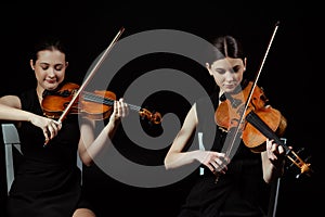 Musicians playing classical music on violins