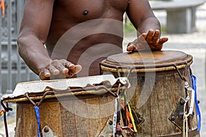 Musicians playing traditional instruments used in capoeira