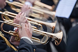 Musicians playing on trumpets