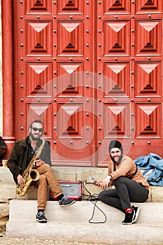 Musicians resting at the door of Convento do Carmo in Lisbon