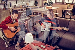 Musicians wearing jeans composing new melody for the song