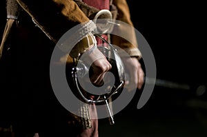 Musketeer o Swordsman over a Black Background photo