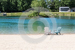 Muskoka chairs on the beach