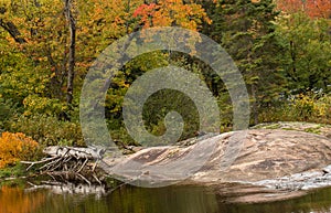 Muskoka water and rock in autumn