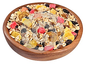 Musli in a wooden bowl on a white