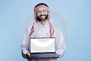 Muslim advertiser holding laptop