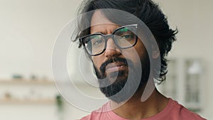 Muslim arabian indian multiethnic man in eyeglasses with serious worried sight portrait sad depressed bearded male in