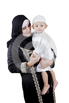 Muslim Arabian mother with her son isolated over white