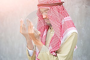 Muslim arabic man praying, prayer concept for faith, spirituality and religion.