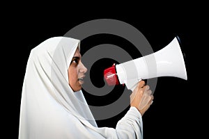 Muslim Arabic woman with hijab shouting through megaphone calling for Hajj
