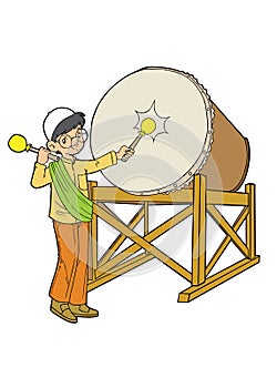 Muslim asian boy playing with drum