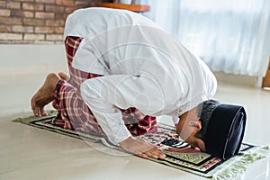 Muslim asian man praying to god