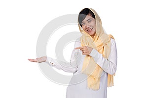 Muslim asian woman isolated presenting