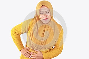 Muslim asian woman suffering from stomach pain