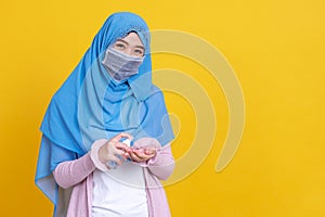 Muslim Asian woman with traditional dress wearing medical face mask