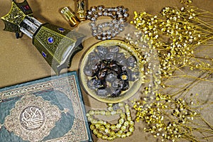 muslim book with arabic calligraphy Quran translation : holy book of Muslims and oud perfume and censer