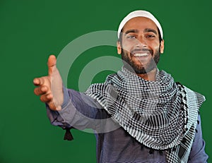 muslim boy hiving his hand for help hand shake on Green screen background