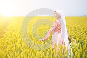 Muslim bride posing at a celebration ceremony on the field. Muslim marriage