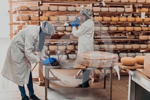 Muslim business partners checking the quality of cheese in the modern industry