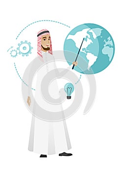 Muslim businessman pointing at a globe.