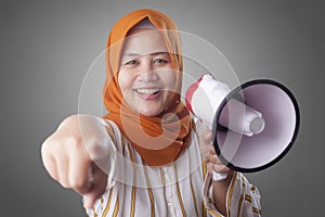 Muslim Businesswoman With Megaphone Pointing Forward, Join Us Concept