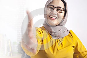 Muslim Businesswoman Offering Hand Shake