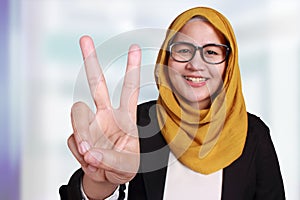 Muslim Businesswoman Showing Number Two Victory Gesture