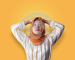 Muslim Businesswoman Thinking Something, Hands Behind Head