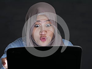 Muslim Businesswoman Working on Laptop Shocked Stunned Excited Gesture