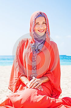 Muslim caucasian (russian) woman wearing red dress