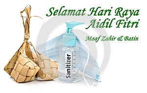 Muslim Celebration greeting or Selamat Hari Raya Aidilfitri with rice dumpling and sanitizer, face mask for protection