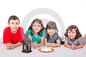 Muslim Children eating Kahk - Kaak ( Cookies ) in the feast