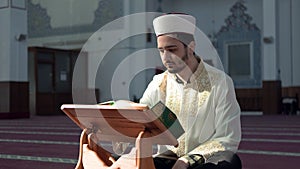 Muslim cleric reading quran