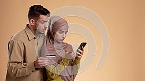 Muslim Couple Having Problem With Phone And Credit Card, Studio