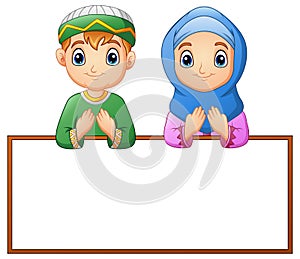 Muslim couple kid praying with blank sign