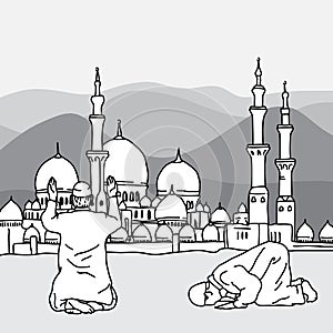 Muslim Doing Salah at the background of a mosque during Ramadan photo