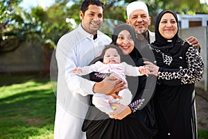 Muslim family, grandparents and parents with baby outdoor, Eid celebration or Ramadan with happiness and generations