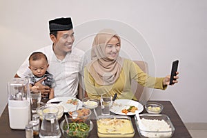 Muslim family make video phone call while dinner