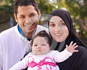 Muslim family, park and portrait of parents with baby for bonding, smile and outdoors together. Islam, happy and mother