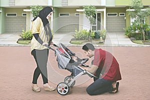 Muslim family playing with their baby