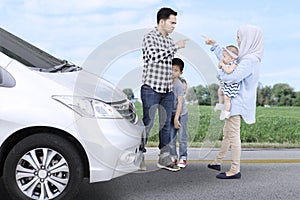 Muslim family quarreling on the roadside