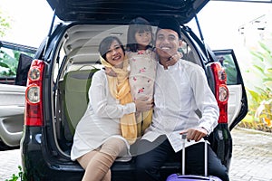 Muslim family with suitcase before traveling