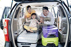 Muslim family with suitcase traveling