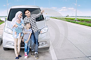 Muslim family with tablet on the highway photo