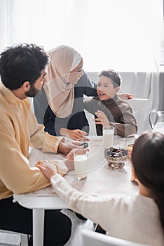 Muslim family talking during traditional suhur photo