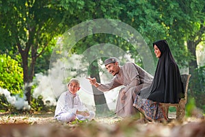 Muslim family with warm light in the morning in thailand