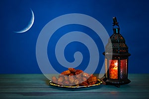 The Muslim feast of the holy month of Ramadan Kareem. Beautiful background with a shining lantern Fanus