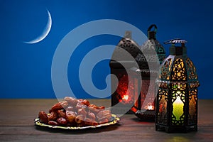 The Muslim feast of the holy month of Ramadan Kareem. Beautiful background with a shining lantern Fanus.