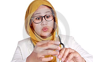 Muslim Female Doctor Holding Injection Syringe