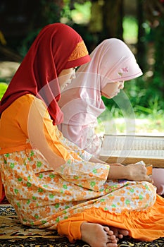 Muslim Female Reading Koran photo